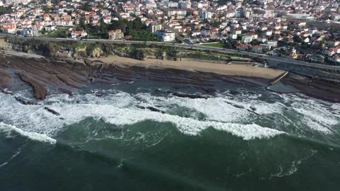 Coastal Drone View of Beach with Cliffside Houses and Ocean Waves Stock Footage 312753919