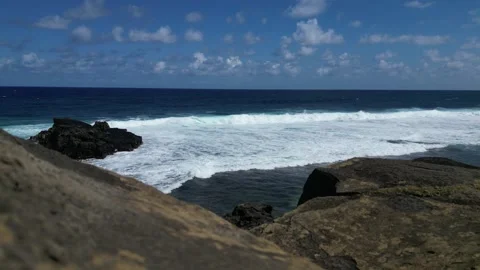 Coastal Elegance: A 4K Seascape Behind the Rocks Stock Footage 259089163