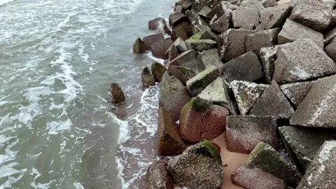 Coastal Erosion man-made buffer zone protects the shores from erosion and Stock Footage 270471787
