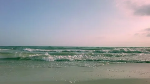 Coastal Evening: Gentle Waves Rolling onto the Beach in Summer Video stock 290208285