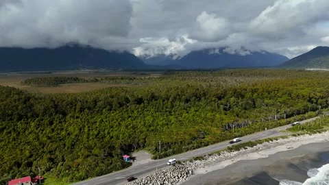 Coastal Highway Through Temperate Forest and Mountains Stock Footage 341618169