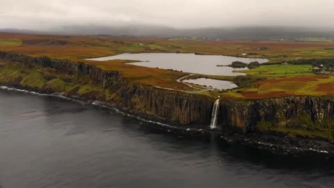 Coastal landscape featuring a dramatic waterfall. Stock Footage 297868972