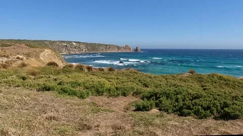 Coastal Landscape with rugged cliffs, turquoise waters, and unique rock for.. Stock-Footage 312065745