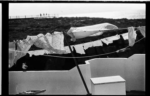 Coastal Laundry Drifting Above Whitewashed Walls Stock Photos