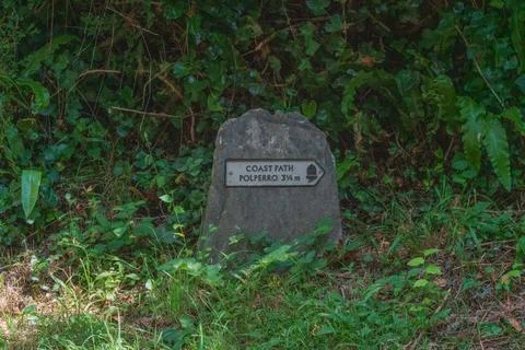 Coastal path direction signpost pointing towards Polperro Фото