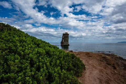 Coastal Path Leading to Stone Tower Stock Photos