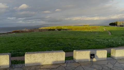 Coastal Pathway with Dramatic Sky and Ocean View Stock Footage 276951877