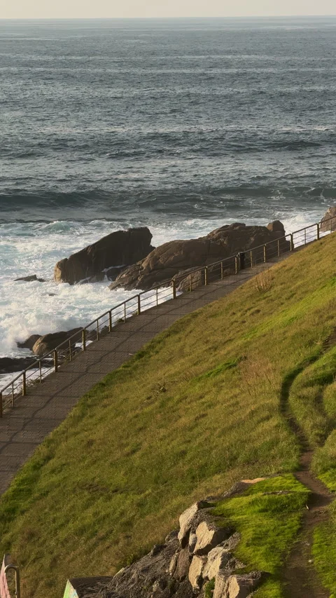 Coastal Pathway: Ocean Waves and Serene Walks Stock Footage 263634307
