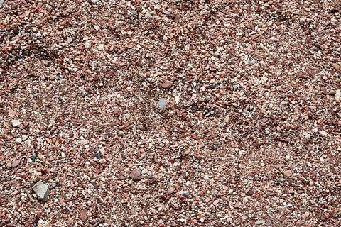 Coastal pebble texture with many small stones Stock Photos