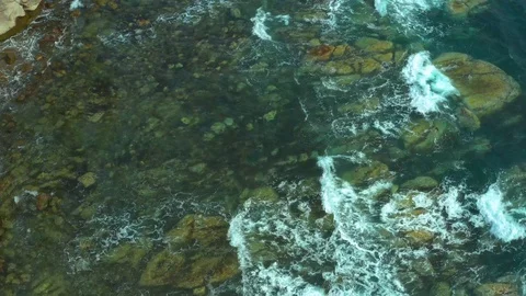 Coastal pitfalls visible through a running sea wave. Stock Footage 129701449