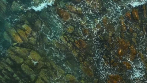 Coastal pitfalls visible through a running sea wave. Stock Footage 129701588