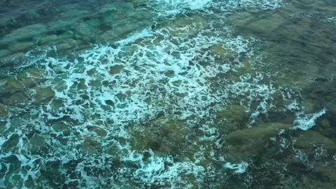 Coastal pitfalls visible through a running sea wave. Stock Footage 129701647