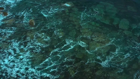 Coastal pitfalls visible through a running sea wave. Stock Footage 129701780