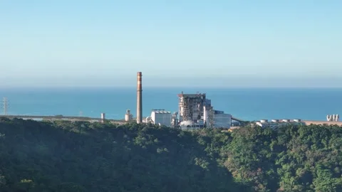 Coastal power generation facility symbolizing industrial growth, electricity Video stock 342959462