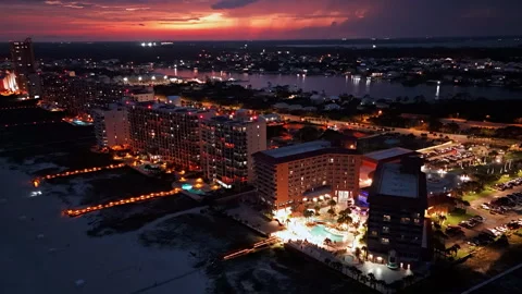 Coastal Resort District Glows Beneath Red Sunset Stock Footage 341622068