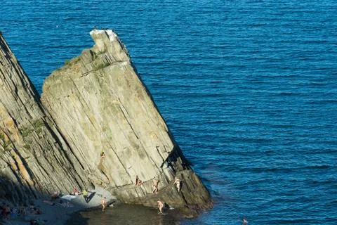 Coastal rocks triangular shape on the background of the sea. 스톡 사진