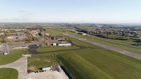 Coastal runway length shown, empty runway panning shot, drone aerial 4K Stock Footage 101183279