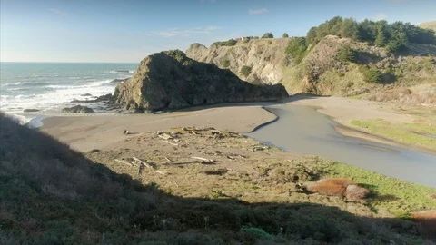 Coastal scene with cliffs, beach, river, and ocean waves.  Point Arena, USA Stock Footage 101718831
