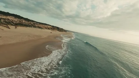 Coastal scene with rolling waves and sand Stock Footage 340226994