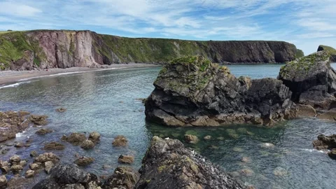 Coastal Sea Stack and Bay at Ballydwan Beach Waterford Ireland Stock Footage 337396671