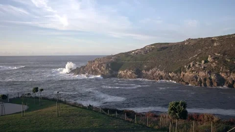 Coastal Serenity: Waves Against the Cliffs Stock Footage 260837255