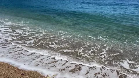 Coastal Symphony: Waves Caressing the Shore Stock Footage 274933149