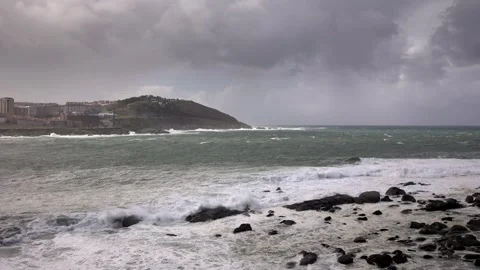 Coastal Tempest: The Dramatic Interplay of Sea and City Stock Footage 265783511