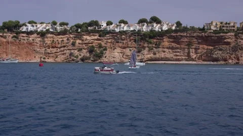Coastal Town On Red Cliffs With Boats On Sea, Clifftop Villas, Wide View Stock Footage 340634334