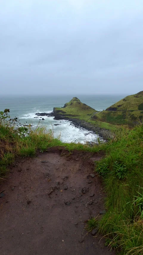 Coastal view of Giant's Causeway with waves crashing Stock Footage 312516981