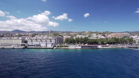 Coastal view of Messina from ferry approaching Sicily on sunny day Stock Footage 330343185