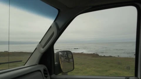 Coastal view through car side mirror along Highway 1 Stock Footage 345167945