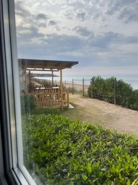 Coastal view from window overlooking beach in Tarragona Стоковые фото