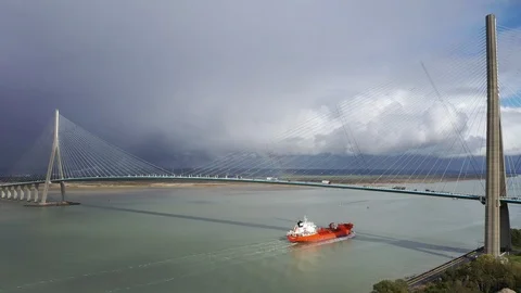 A coaster sails up the River Seine under a road bridge. Stock Footage 126508783