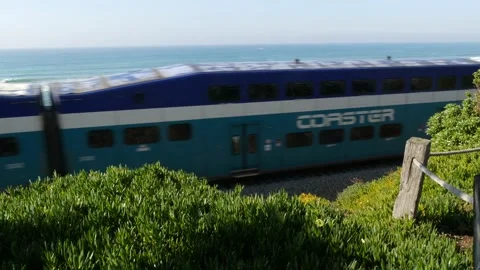 Coaster train along pacific ocean. Passenger railroad, public transit. Californi Stock-Footage 141658533