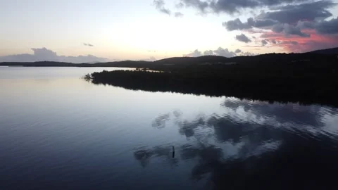 Coastline and Mountainous Background During Golden Hour Stock Footage 273836302