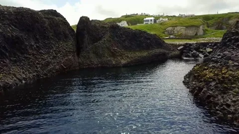 Coastline, Between rocks following the ocean waves Stock Footage 211802426