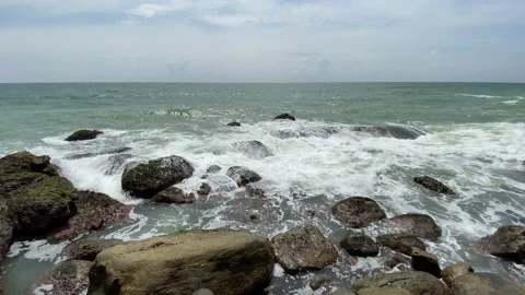 Coastline with big waves hitting the black rocks Stock Footage 164873089