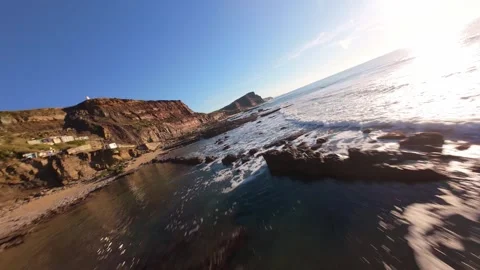 Coastline with dramatic waves crashing over volcanic rock formations Stock Footage 344561523