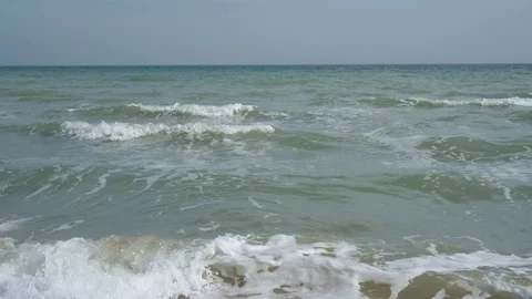 Coastline. Small waves roll ashore. Video stock 126160418