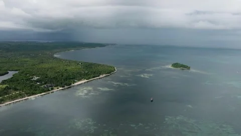 Coastline with tropical forest and small offshore island. Siargao, Philippines. Stock Footage 345263694