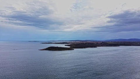 Coastline view of islands and distant land under cloudy sky Stock Footage 335143789