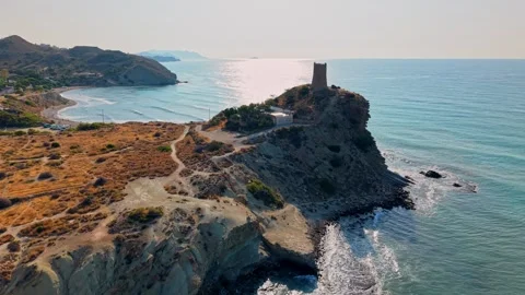 Coastline view of an old tower on a cliff by the water in Spain Stock Footage 346017745