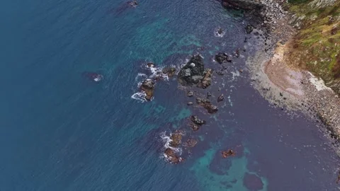 Coastline view showing rocks and clear water near a shore Stock-Footage 335142829