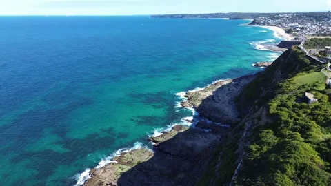 Coastline View of Turquoise Ocean Cliffs and Beachside Video stock 334903883