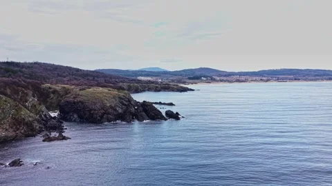 Coastline viewed from a high point during cloudy weather Vidéo 335142485