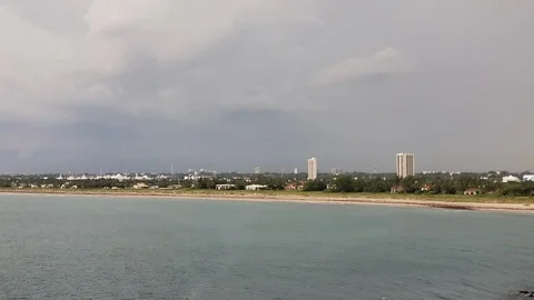Coastline of West Palm Beach, FL with Lightning Strike at the End - 1 Stock Footage 109247053