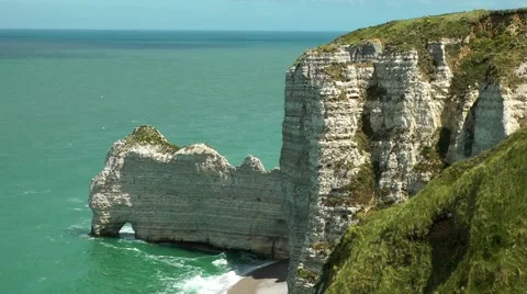 Coastline white rocks cliff tops sea arch waves Stock Footage 60445706