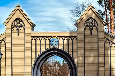 Coat of arms on the gate. Фото