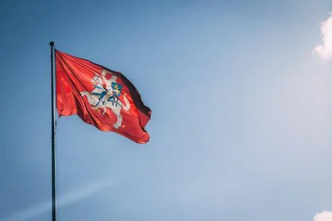 The coat of arms of Lithuania. Knight on a horse on a red background. Blue sk Stock Photos