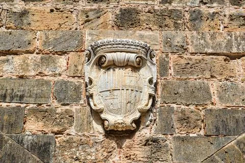 Coat of arms on the old wall. Stock Photos